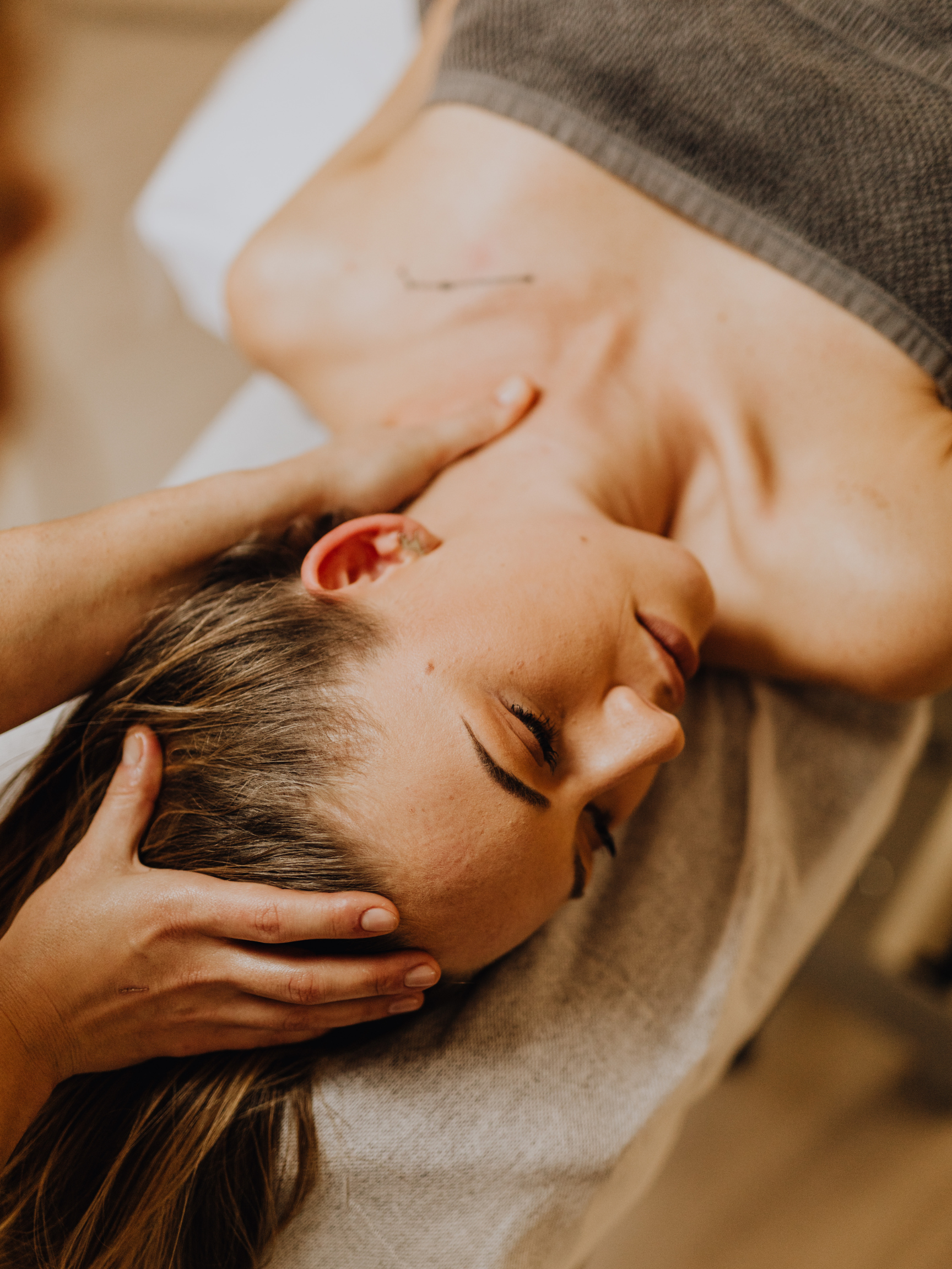 Woman laying on a table receiving a massage