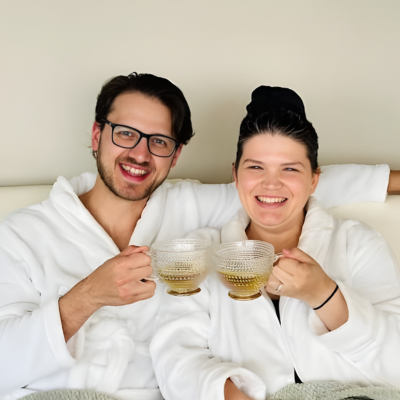 Married couple enjoying tea at the spa in robes